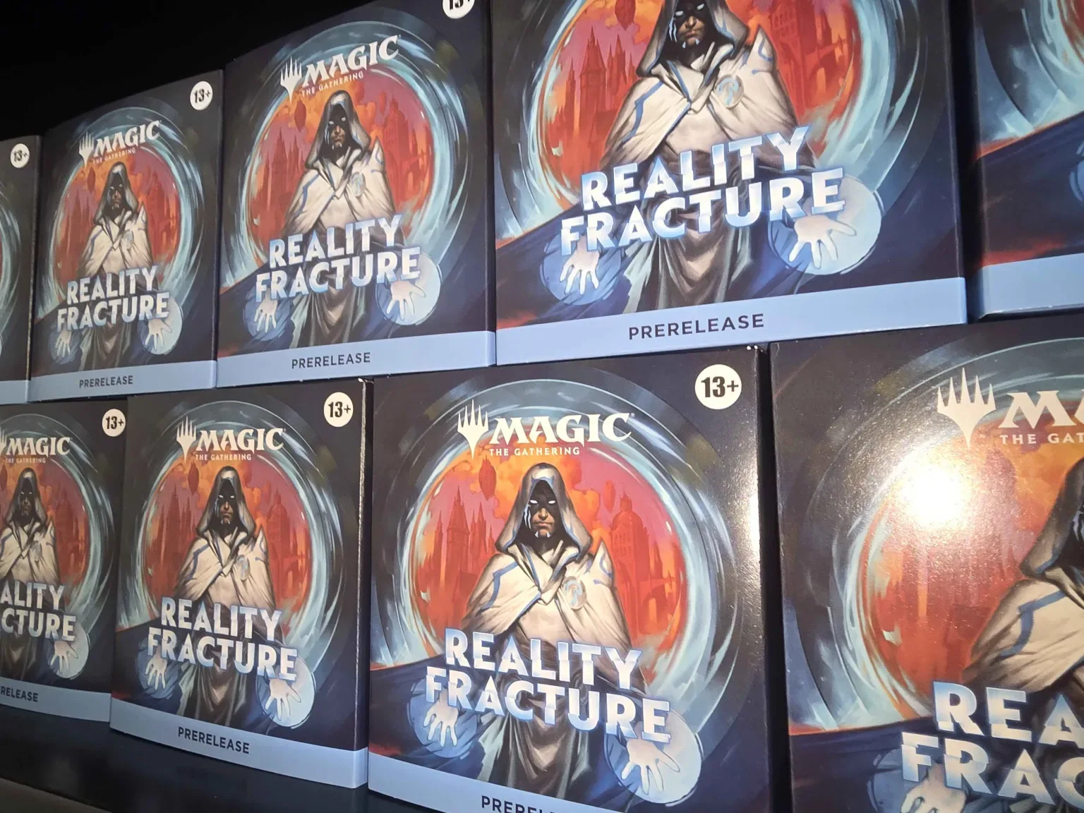 Reality Fracture prerelease boxes stacked ready for events at Ravenspire Games